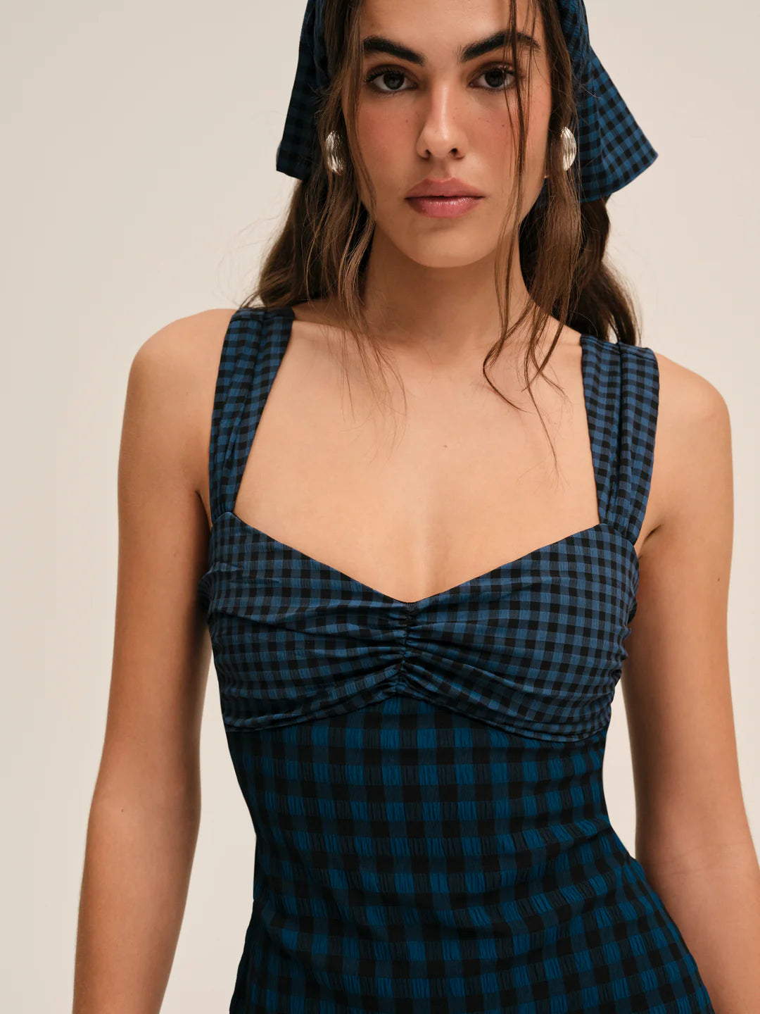 blue river mini dress River Island open back bow detailed mini dress in mid-wash blue